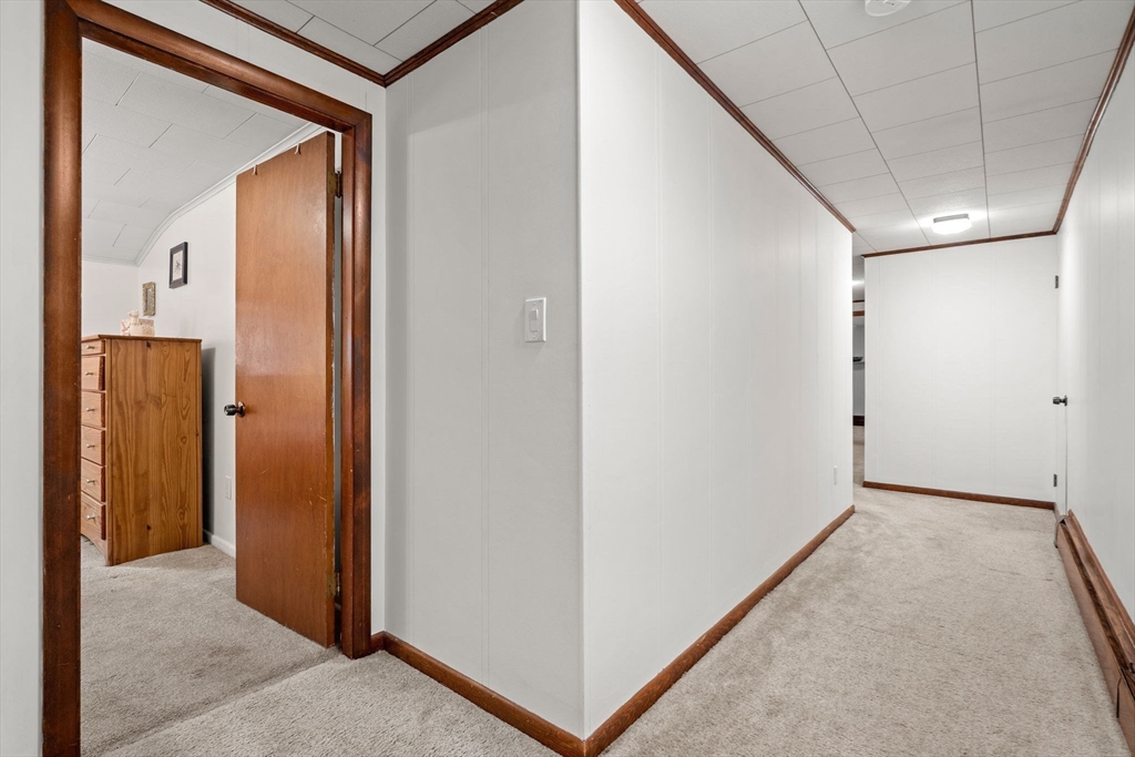 58 Spring Street Wakefield, MA 01880 - Photo 25 of 41 a view of a hallway to rooms