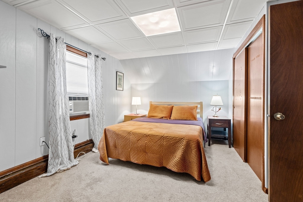 58 Spring Street Wakefield, MA 01880 - Photo 26 of 41 a bedroom with a bed and a window