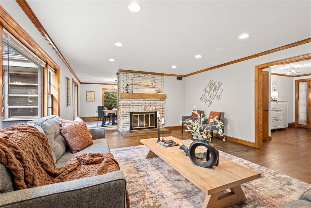 58 Spring Street Wakefield, MA 01880 - Photo 3 of 41 a living room with furniture and a fireplace