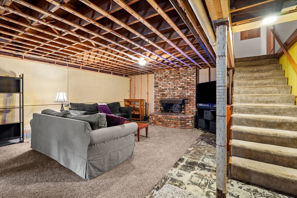 58 Spring Street Wakefield, MA 01880 - Photo 34 of 41 a living room with furniture and a flat screen tv