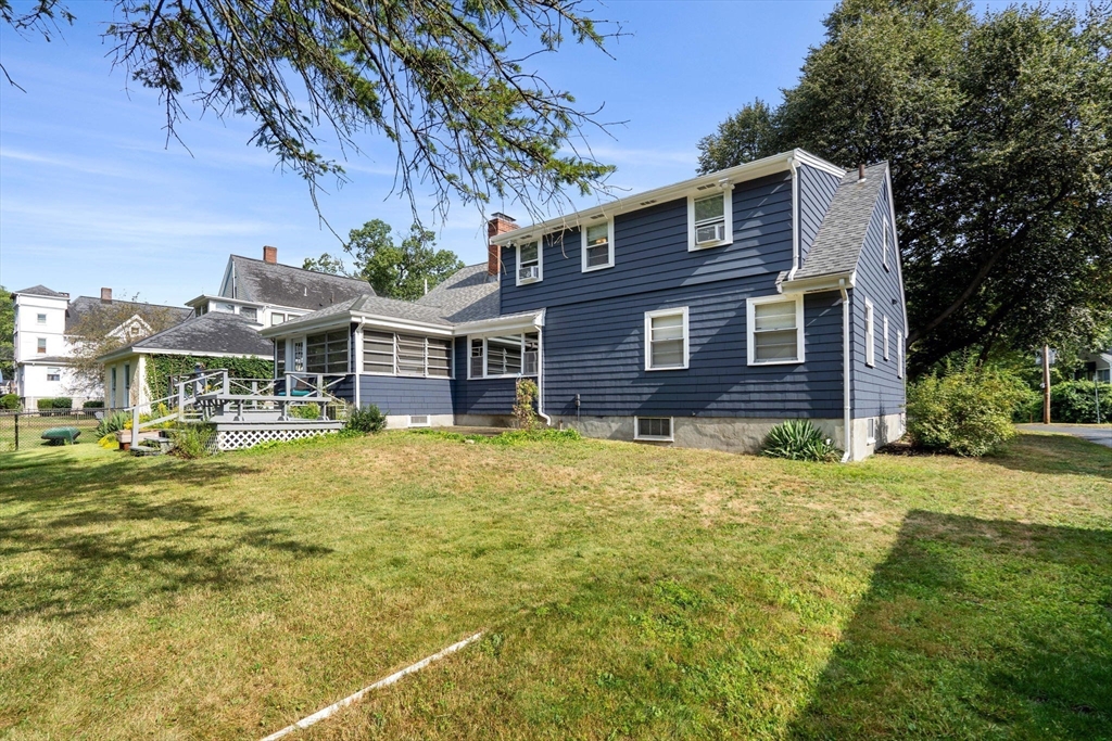 58 Spring Street Wakefield, MA 01880 - Photo 35 of 41 a front view of a house with a garden
