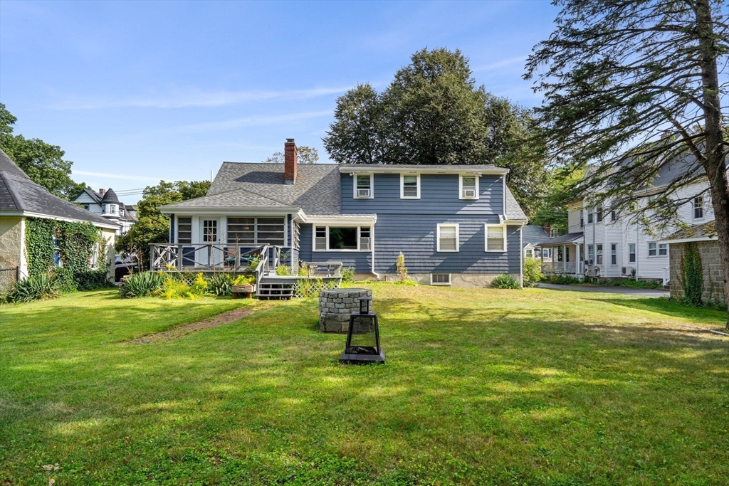 58 Spring Street Wakefield, MA 01880 - Photo 36 of 41 a front view of a house with a garden