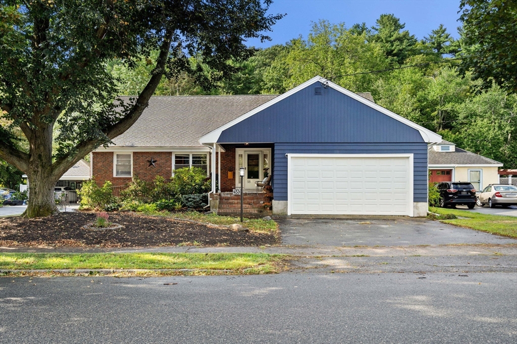 58 Spring Street Wakefield, MA 01880 - Photo 40 of 41 a view of a house with a yard and large tree