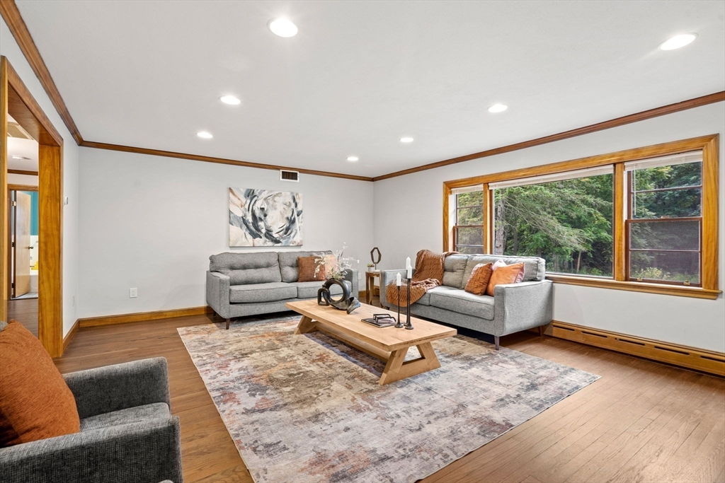 58 Spring Street Wakefield, MA 01880 - Photo 4 of 41 a living room with furniture and large windows