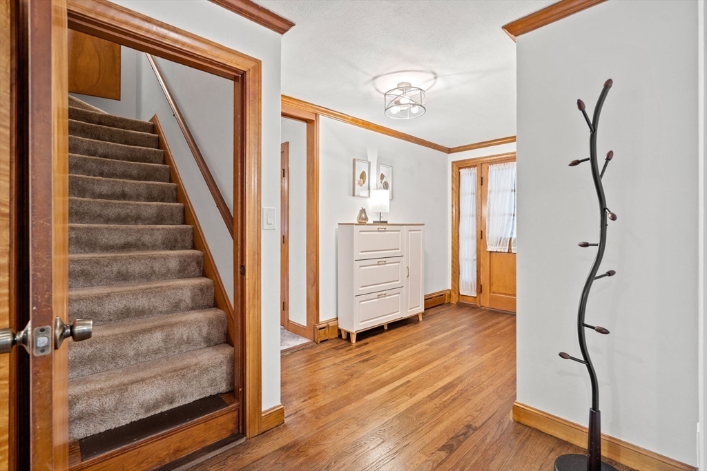 58 Spring Street Wakefield, MA 01880 - Photo 6 of 41 a view of an entryway with wooden floor