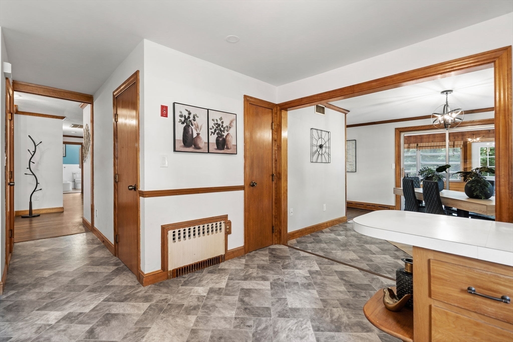 58 Spring Street Wakefield, MA 01880 - Photo 10 of 41 a room with a bed and a mirror