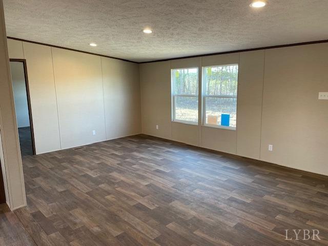 470 Central Church Road Appomattox, VA 24522 - Photo 3 of 12 an empty room with wooden floor and windows