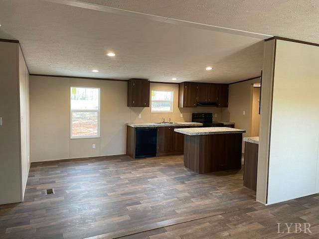 470 Central Church Road Appomattox, VA 24522 - Photo 5 of 12 a kitchen with granite countertop a sink and cabinets