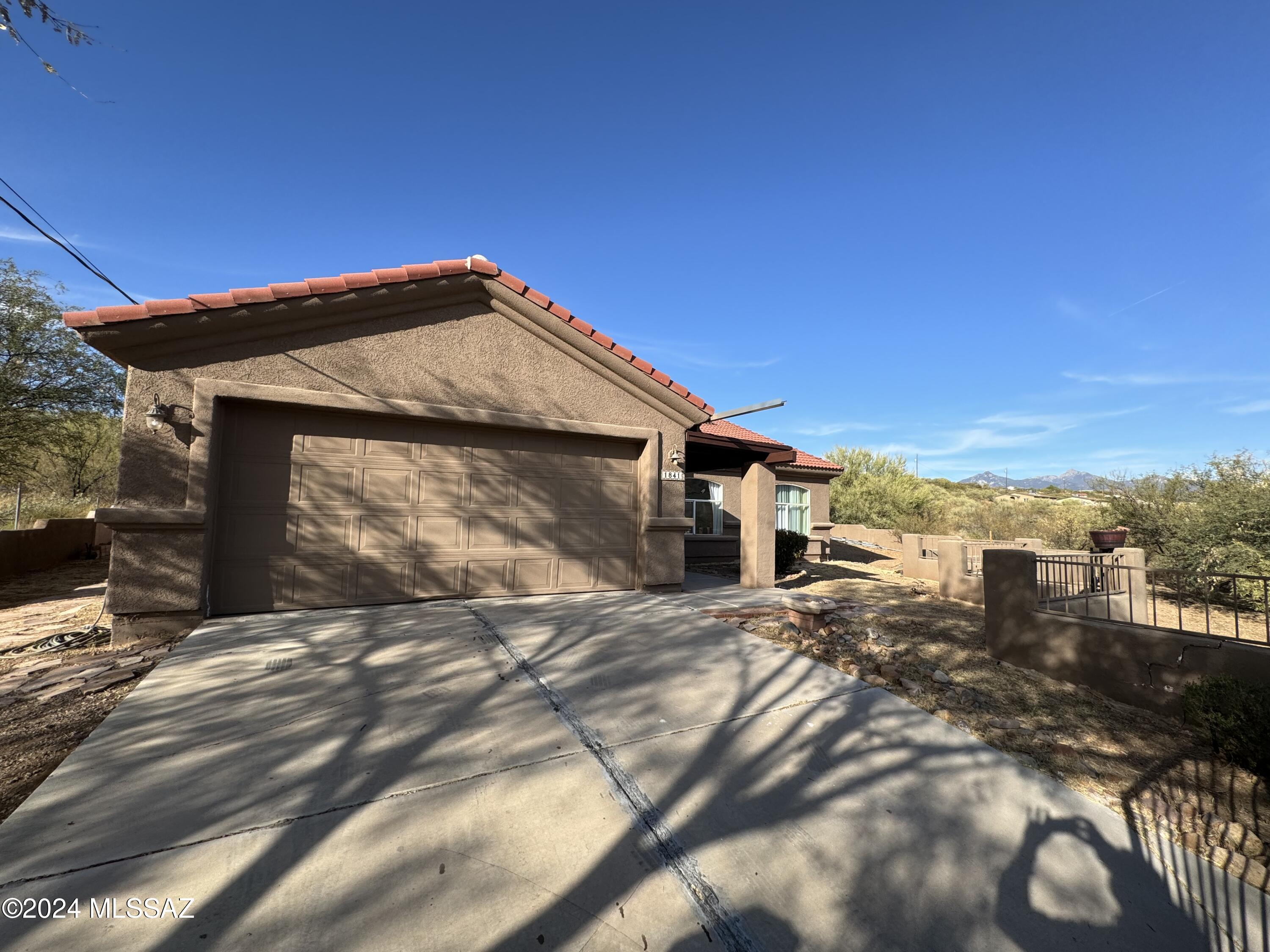 1841 America Court Rio Rico, AZ 85648 - Photo 2 of 38 a view of a house with a yard