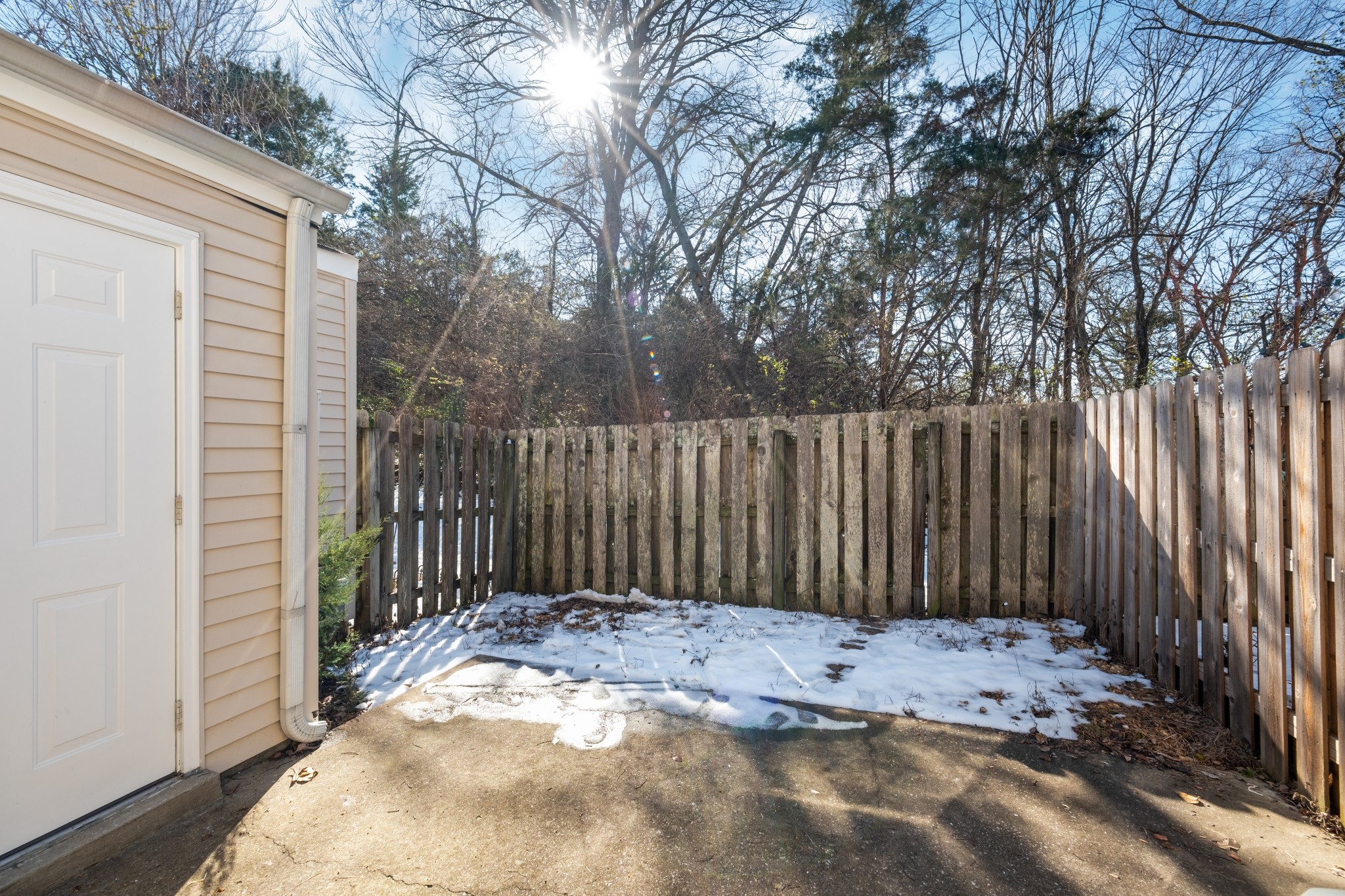 1101 Downs Boulevard, Unit E102 Franklin, TN 37064 - Photo 21 of 24 a view of a wooden fence