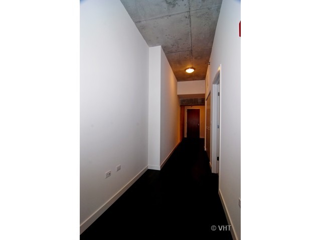 235 West Van Buren Street, Unit 3520 Chicago, IL 60607 - Photo 16 of 17 a view of a hallway with a white walls