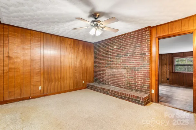 a view of kitchen with refrigerator and window