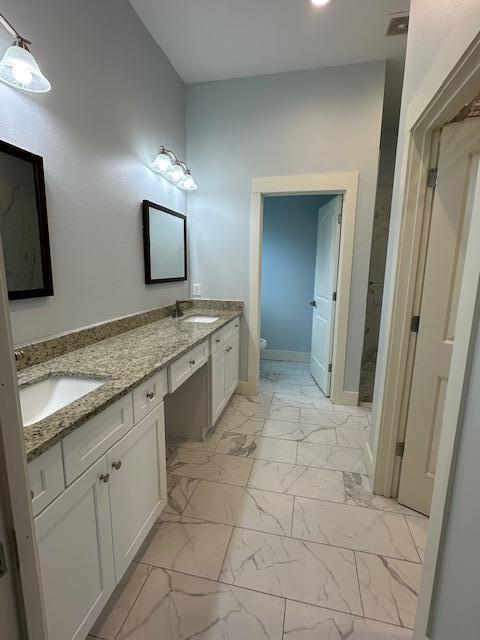512 Harborview Circle Niceville, FL 32578 - Photo 11 of 27 a spacious bathroom with a granite countertop sink a mirror and a vanity