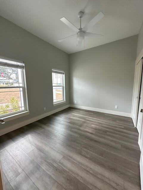 512 Harborview Circle Niceville, FL 32578 - Photo 15 of 27 an empty room with wooden floor and windows