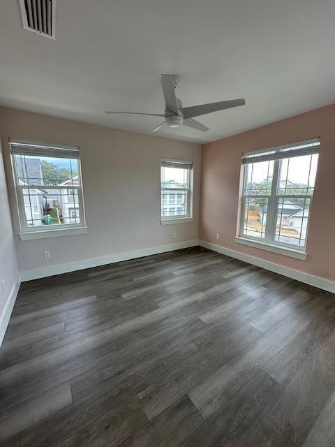 512 Harborview Circle Niceville, FL 32578 - Photo 21 of 27 a view of an empty room with wooden floor and a window