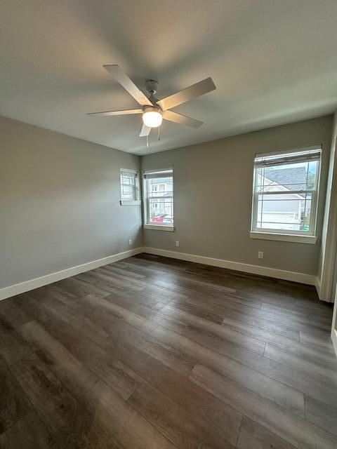 512 Harborview Circle Niceville, FL 32578 - Photo 22 of 27 an empty room with wooden floor and windows