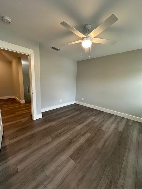 512 Harborview Circle Niceville, FL 32578 - Photo 23 of 27 an empty room with wooden floor and windows