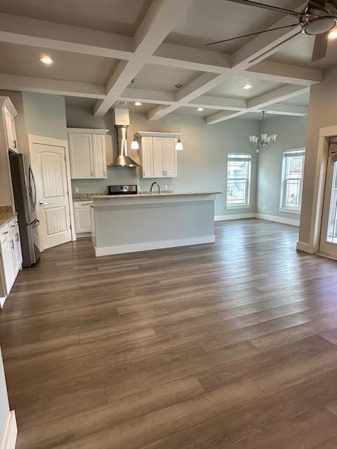 512 Harborview Circle Niceville, FL 32578 - Photo 3 of 27 a view of kitchen and empty room with wooden floor