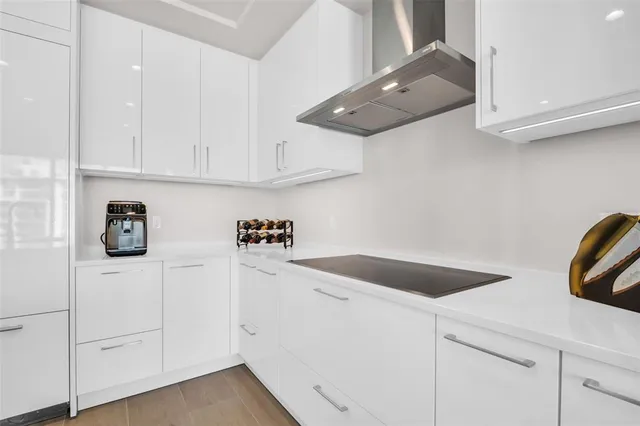 a living room with furniture and floor to ceiling windows