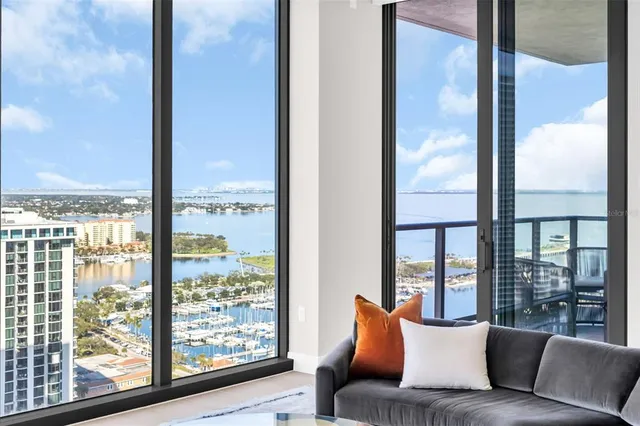 a spacious bedroom with a bed and a couch