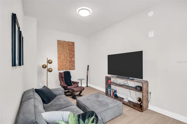 a bedroom with a bed and glass walk in closet