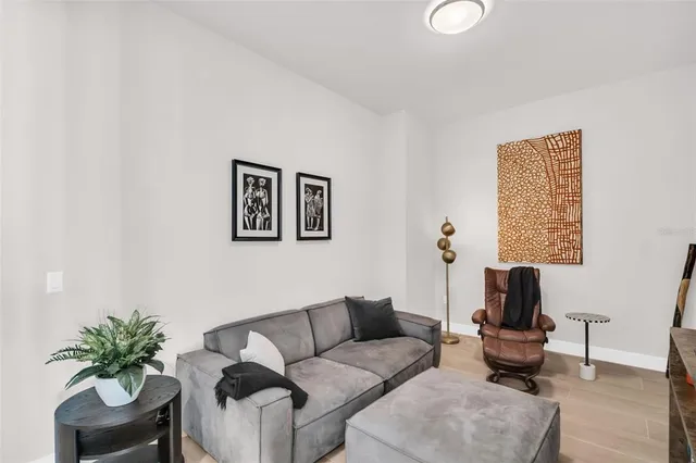 a bedroom with a large bed and a large window