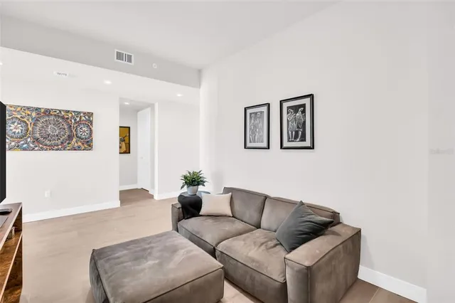 a bedroom with a bed and glass window