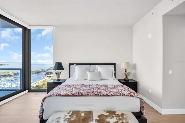 a living room with furniture and a large mirror