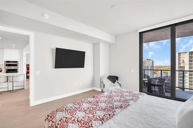 a view of living room with furniture and potted plants