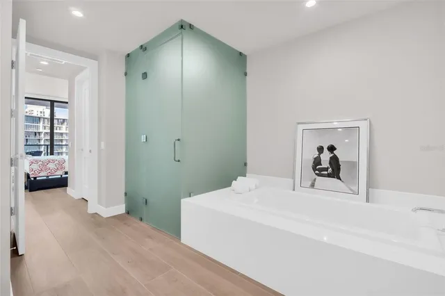 a dining room with furniture and wooden floor