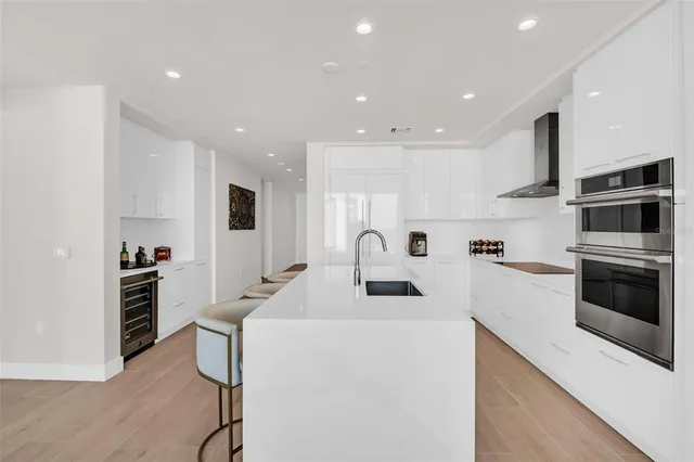 a living room with furniture and a painting on the wall