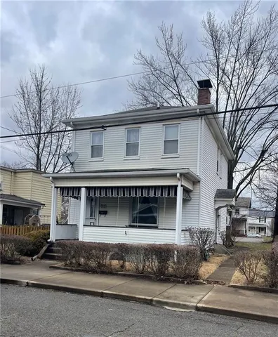 a front view of a house with a garage