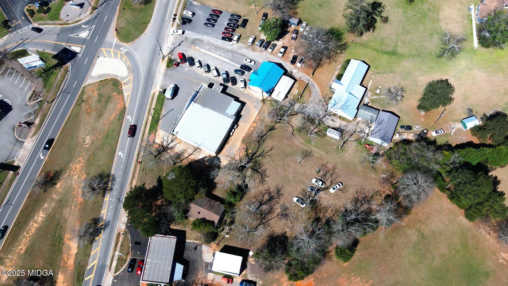 1312 Sam Nunn Boulevard Perry, GA 31069 - Photo 6 of 9 an aerial view of a house with a yard and outdoor seating