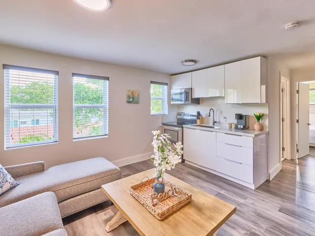 a living room with furniture and a window