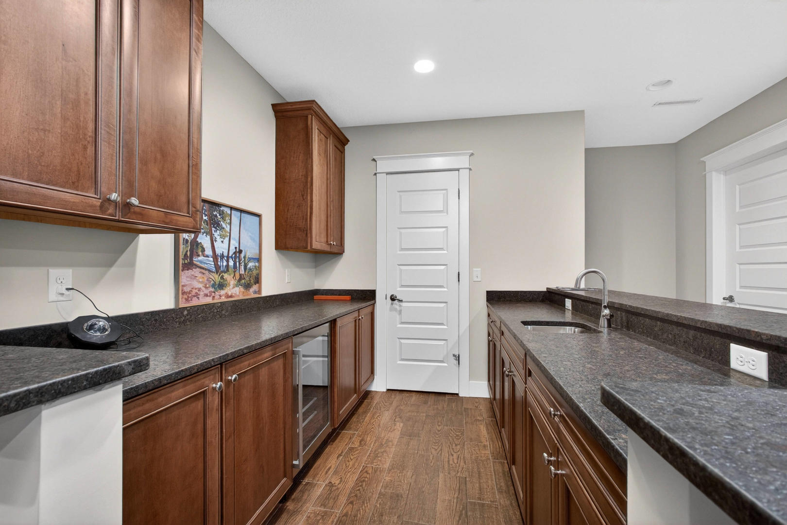 5700 Emily Road Bettendorf, IA 52722 - Photo 40 of 58 a kitchen with granite countertop a sink stove and cabinets