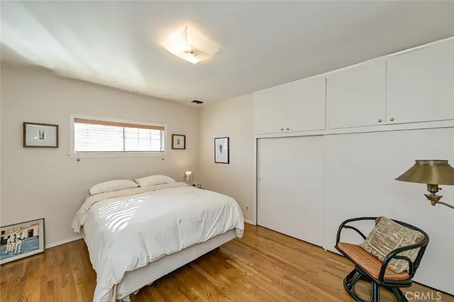 a bedroom with a bed and a table in it