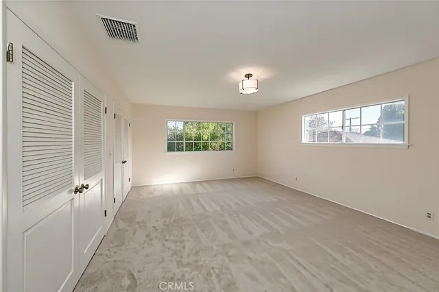 an empty room with windows