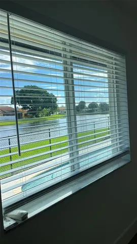a view of a wooden floor and a window
