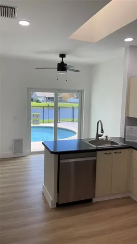 a view of cabinets and wooden floor