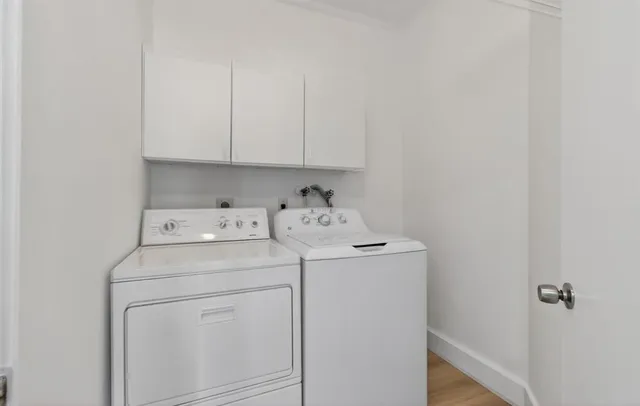 a view of a kitchen with a sink and a cabinets