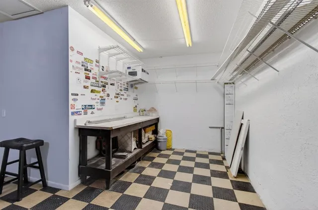 a room with a black white checkered floor