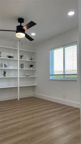 a view of a room with rack on the wall and window