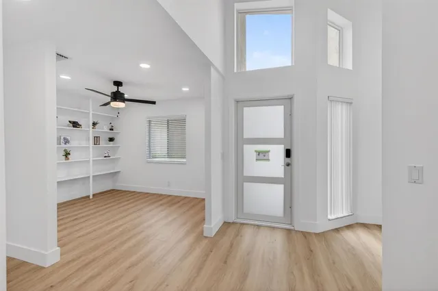 wooden floor in an empty room with a window
