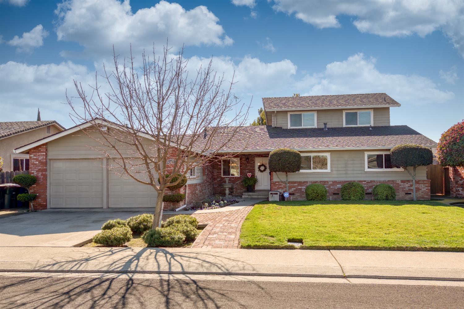 1904 Kendall Avenue Modesto, CA 95355 - Photo 1 of 1 a front view of a house with a yard