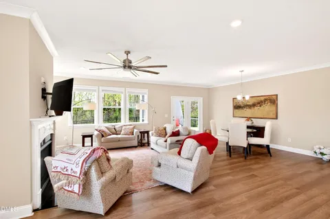 a living room with furniture fireplace and flat screen tv