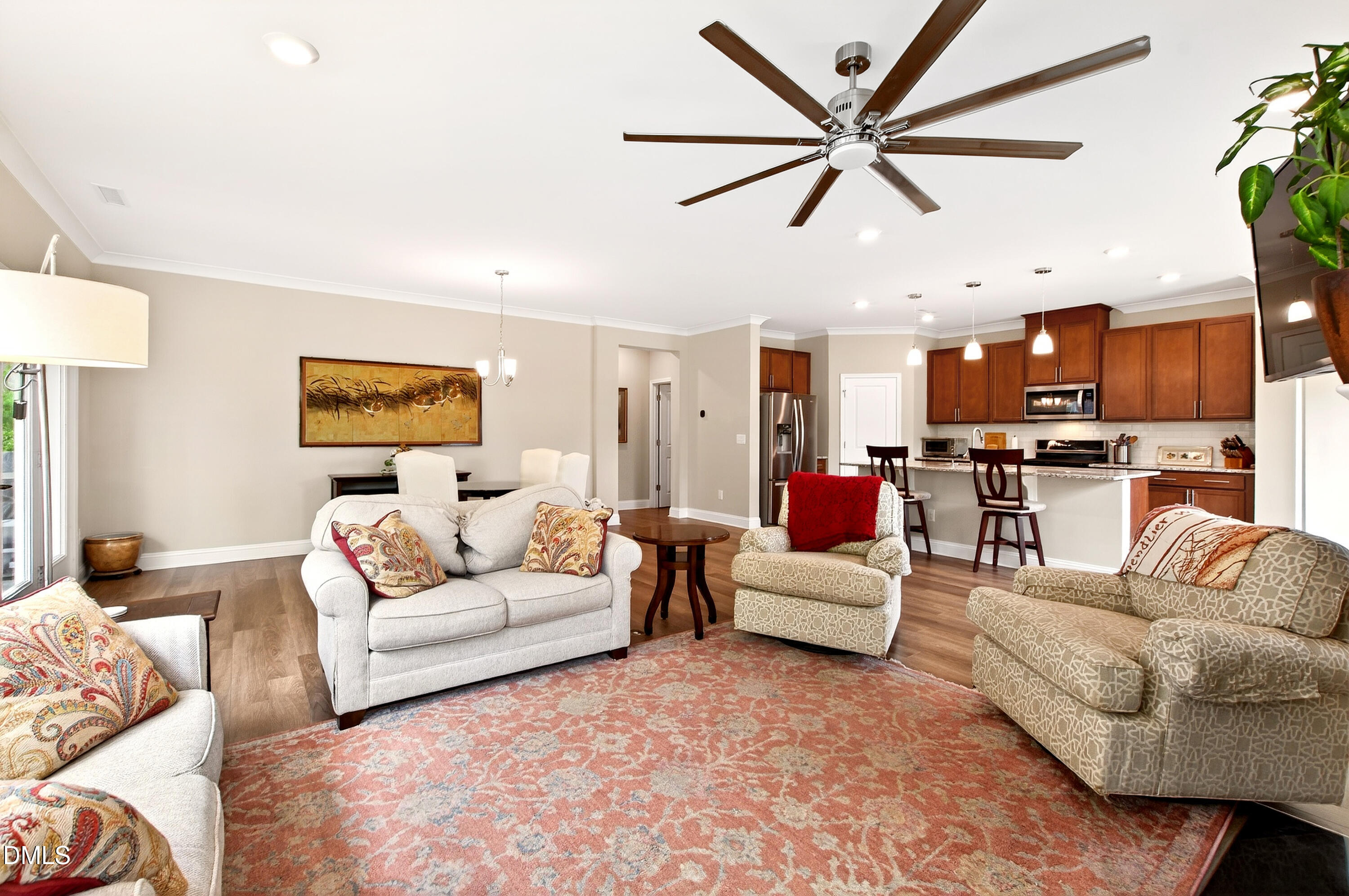339 Summer Ranch Drive Fuquay-Varina, NC 27526 - Photo 12 of 42 a living room with furniture kitchen view and a chandelier