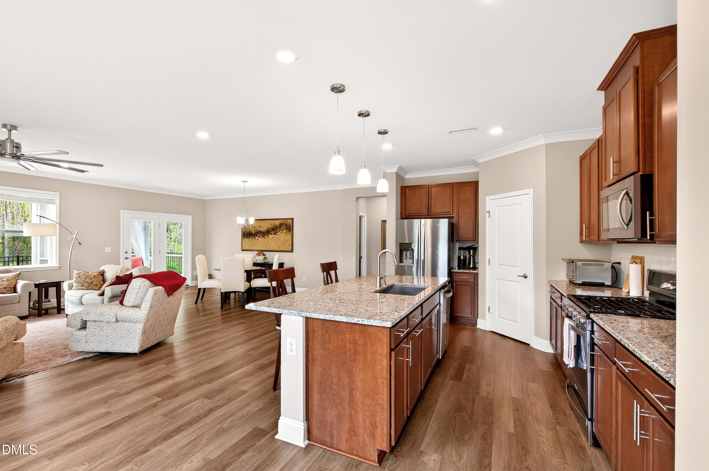 339 Summer Ranch Drive Fuquay-Varina, NC 27526 - Photo 18 of 42 a large kitchen with stainless steel appliances lots of counter top space