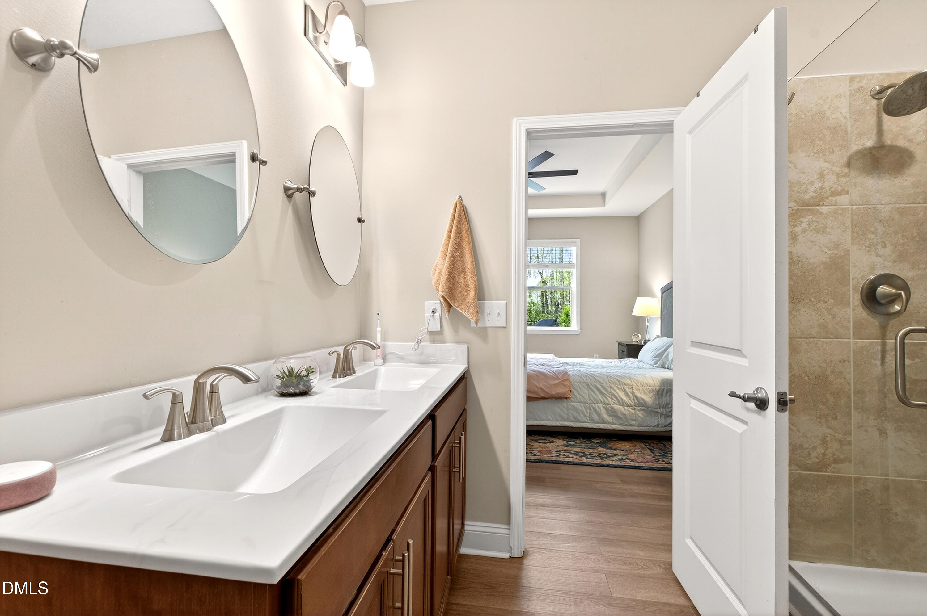 339 Summer Ranch Drive Fuquay-Varina, NC 27526 - Photo 22 of 42 a en suite bathroom with a double vanity sink and a mirror