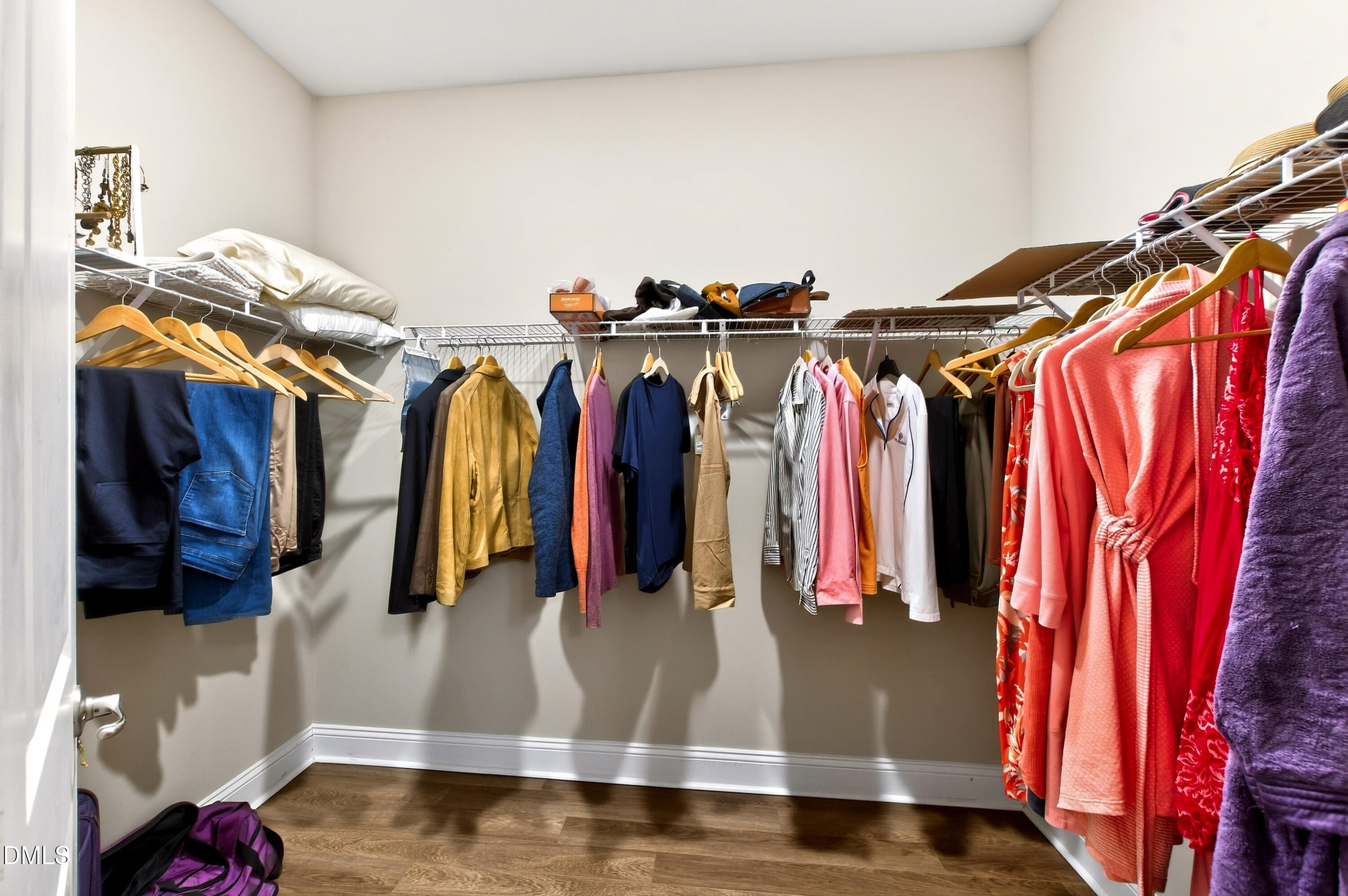 339 Summer Ranch Drive Fuquay-Varina, NC 27526 - Photo 24 of 42 a view of walk in closet with clothes and shoes