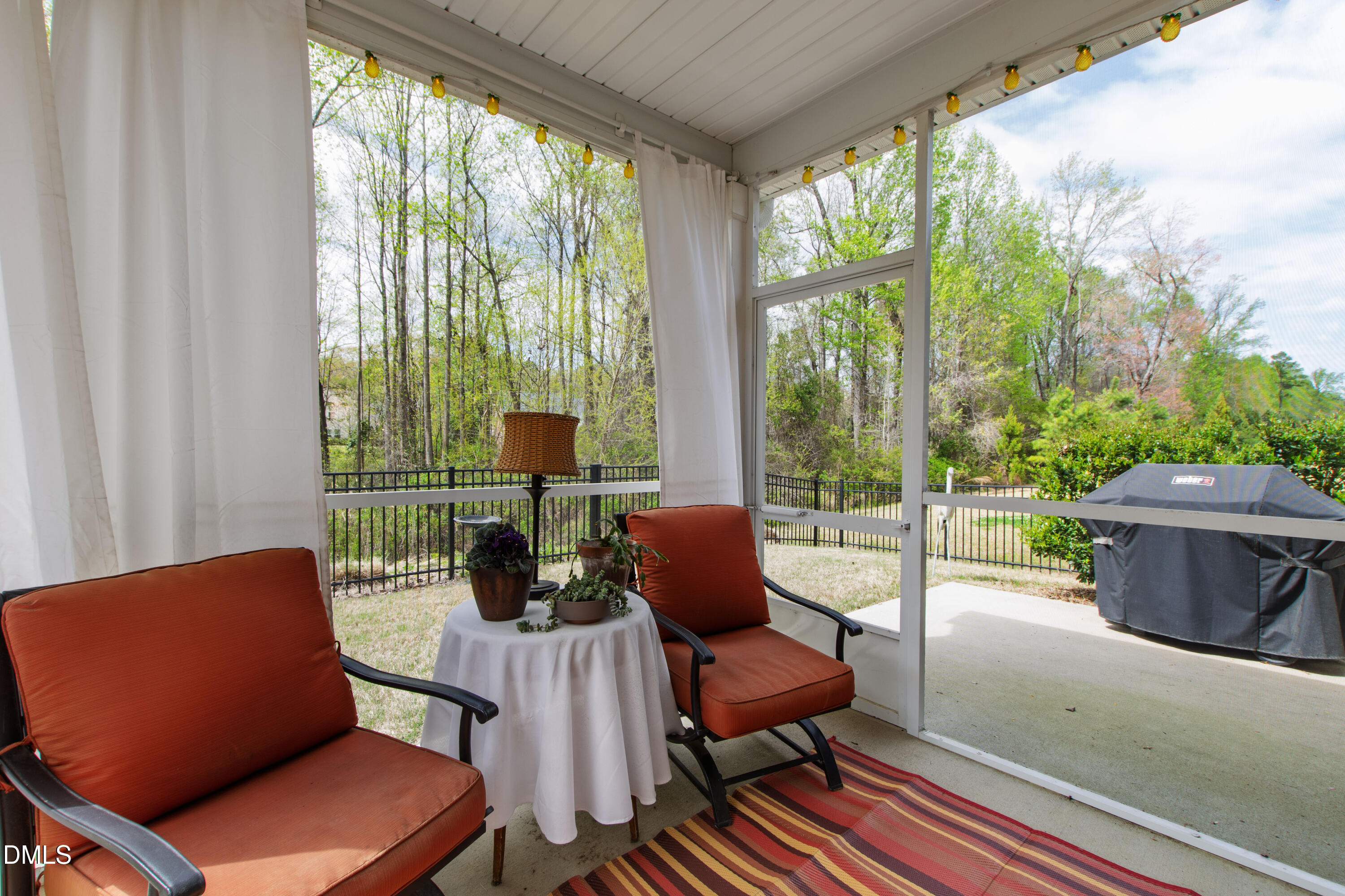339 Summer Ranch Drive Fuquay-Varina, NC 27526 - Photo 33 of 42 a living room with furniture and a floor to ceiling window
